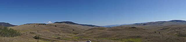 A grassland with rolling hills.